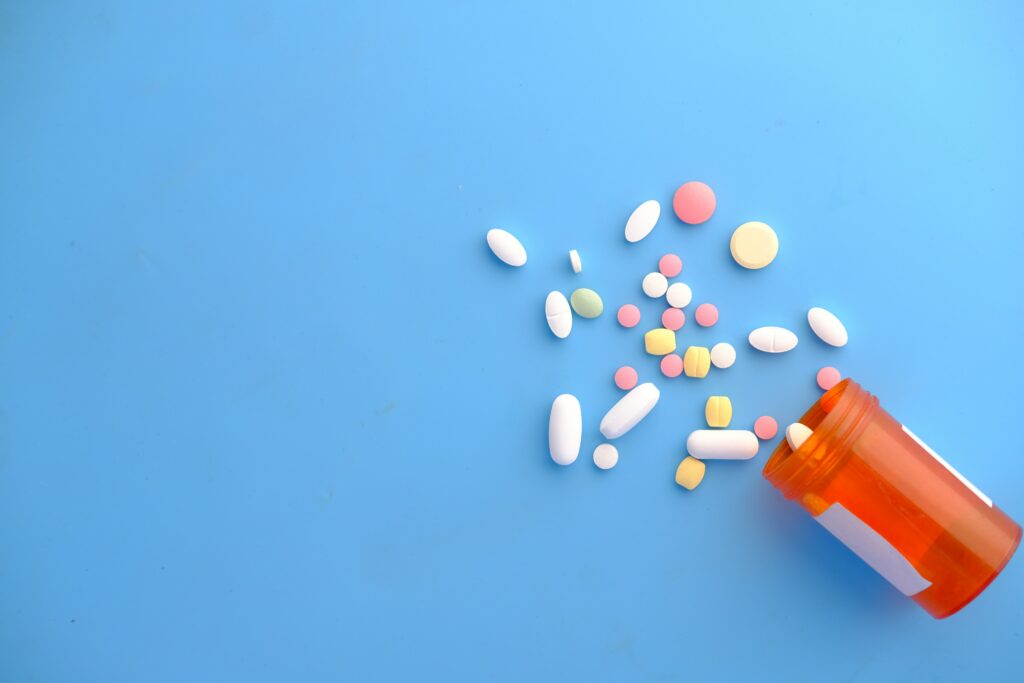 a picture of a pill bottle spilling 