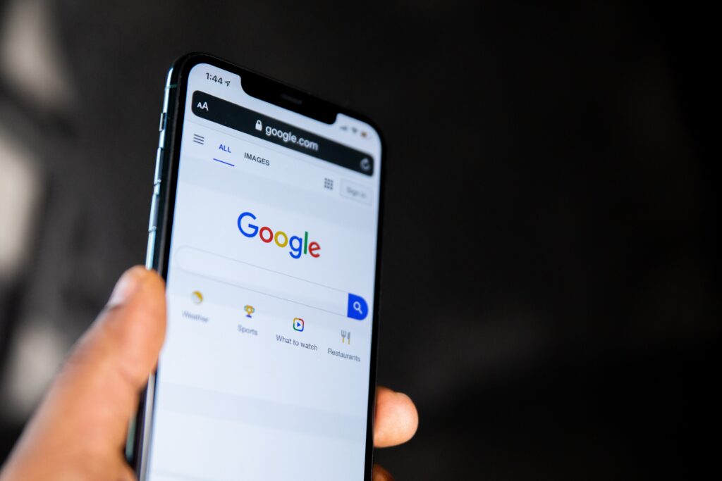picture of a phone with the google search engine on the screen 
